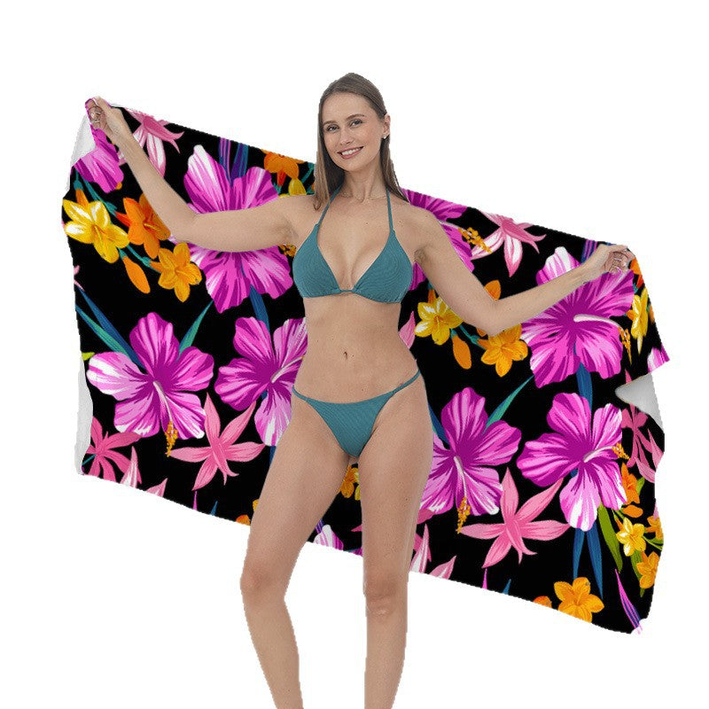 Beach towel with vibrant tropical plant motif Kalsten