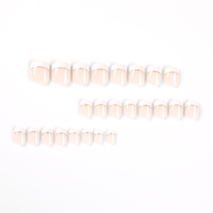 Artful nail extensions with elegant French tip and gold accents Kalsten