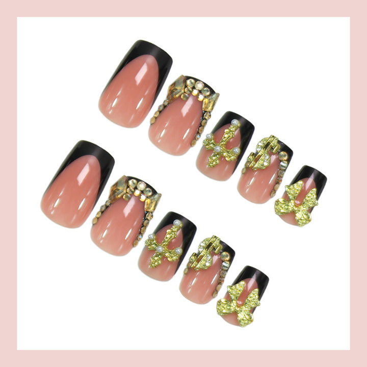 Artificial nails with elegant gold decorations and stylish black Kalsten