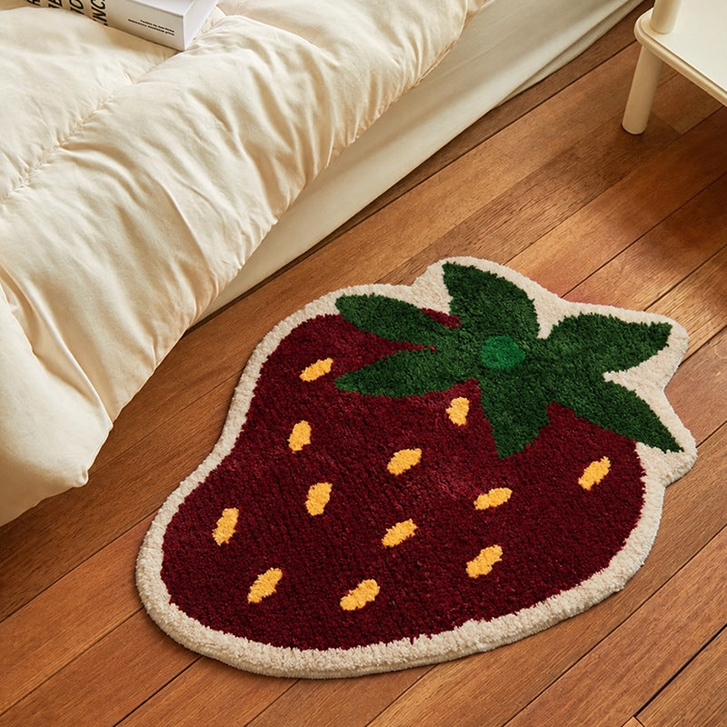 Playful hand-tufted strawberry mat made of dense cotton blend