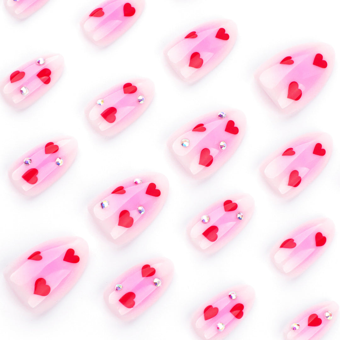 Artful nail art with heart motifs and glamorous details Kalsten