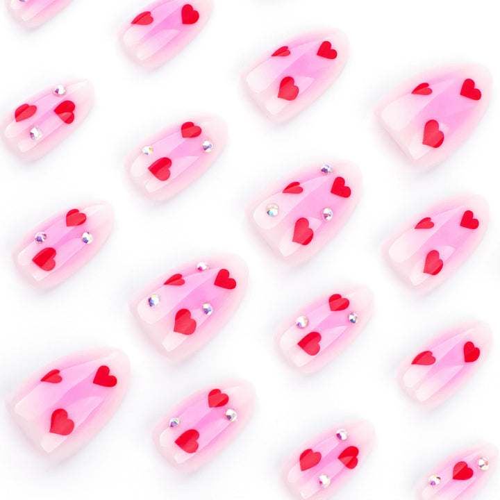 Artful nail art with heart motifs and glamorous details Kalsten