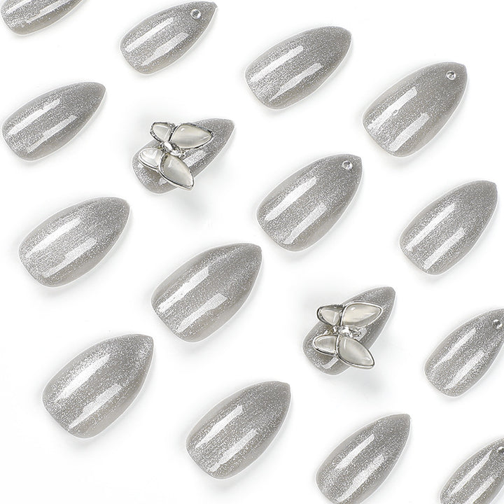 Glamorous stiletto nails with radiant glitter and elegant 3D design Kalsten