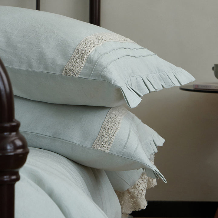 High-quality linen bedding set with handcrafted crochet lace, box pleats, and integrated bed skirt