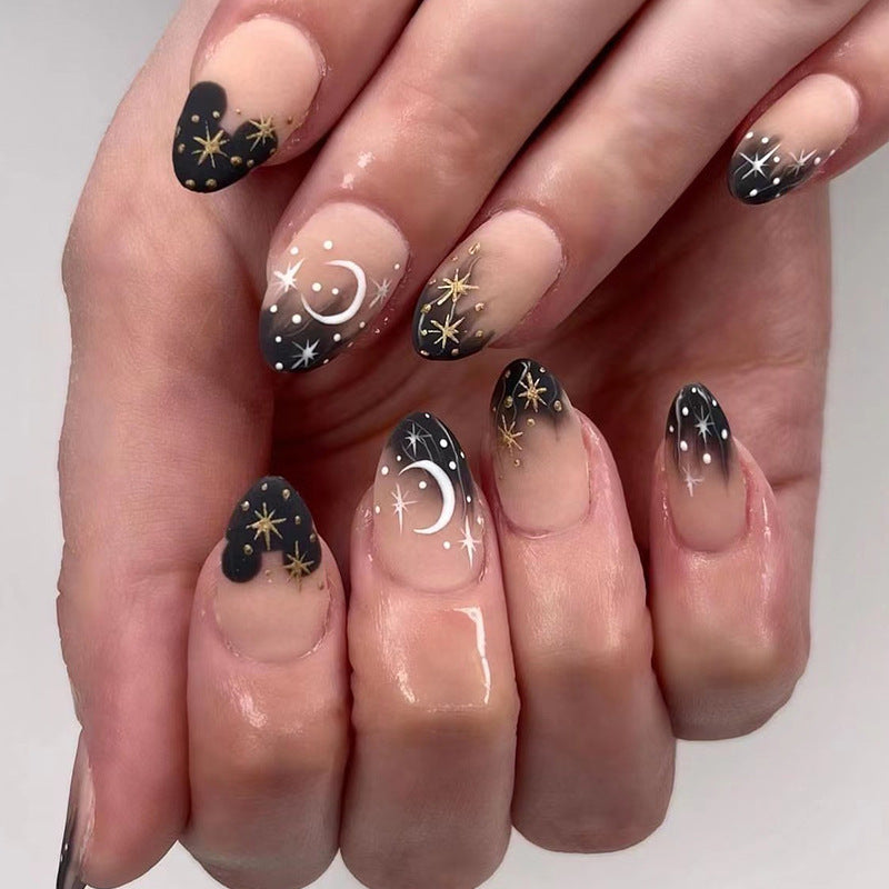 Artistic nail art with moon and star motifs Kalsten