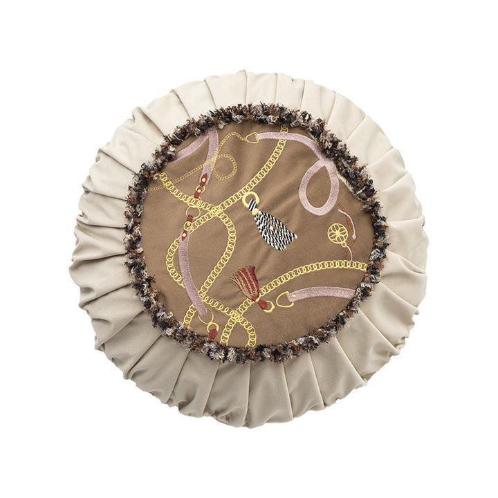 Round decorative cushion with pleated hem and embroidered central panel