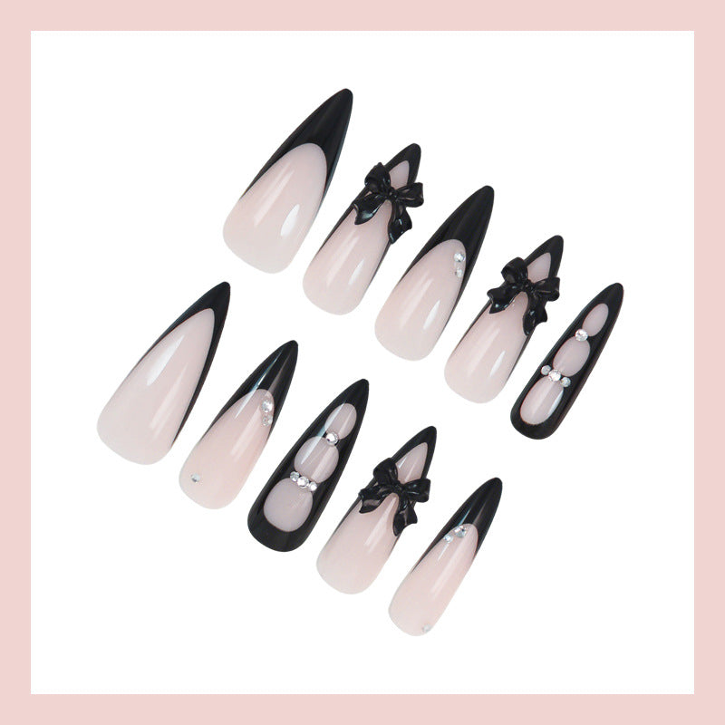 Acrylic nail set with shimmering accents and elegant bows Kalsten