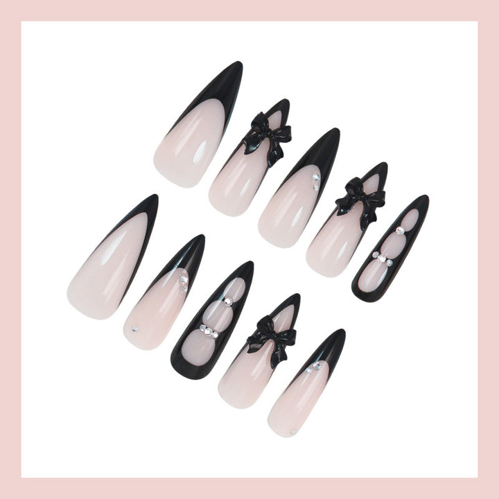 Acrylic nail set with shimmering accents and elegant bows Kalsten