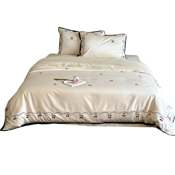 Noble satin bed linen set with cherry applique, decorative piping and frill