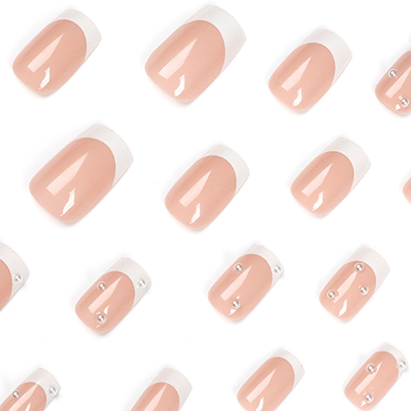 Artful nail art with elegant pearl and glitter accents Kalsten