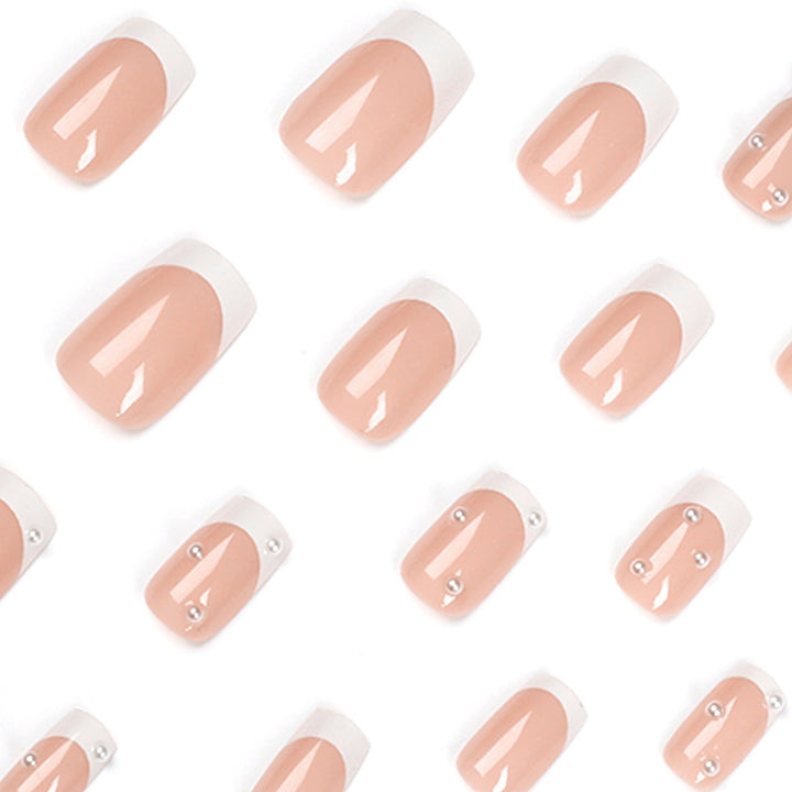 Artful nail art with elegant pearl and glitter accents Kalsten