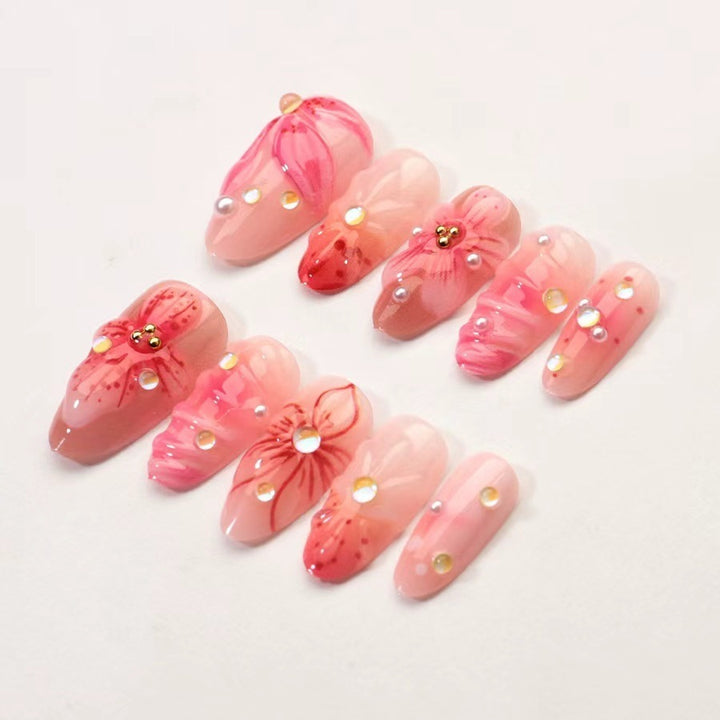 Artificial nail set with floral designs and sparkling accents Kalsten