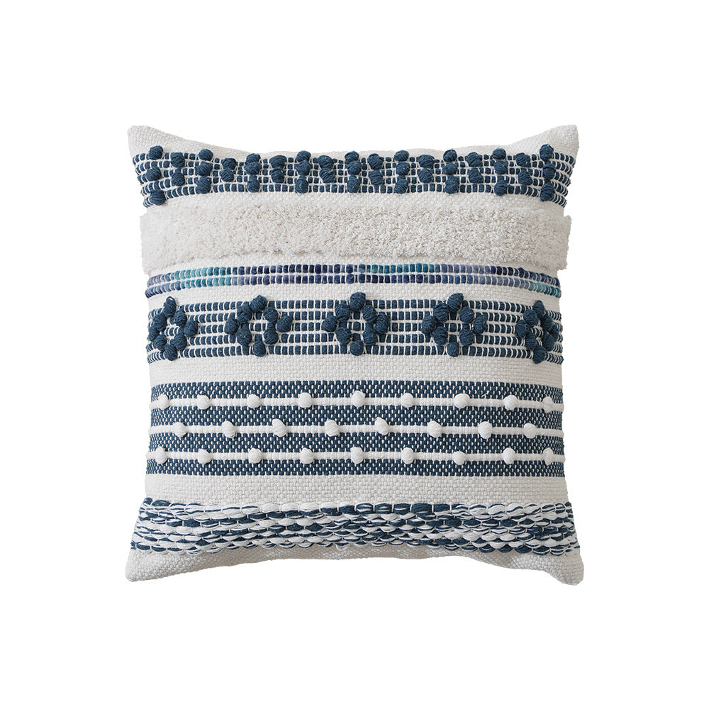 Structured decorative pillow with tufted diamonds, relief border, and corner tassels