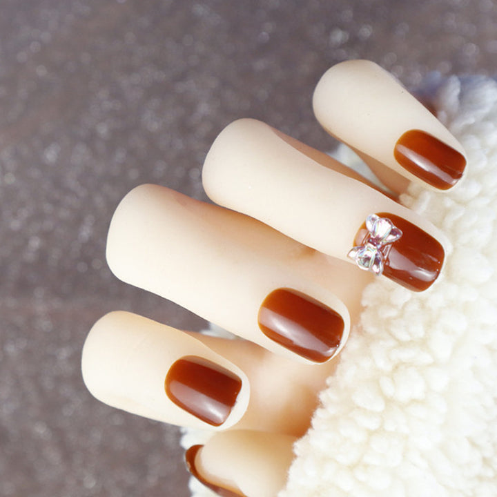 Elegant Press-On Nail Design with Rhinestone Accent
