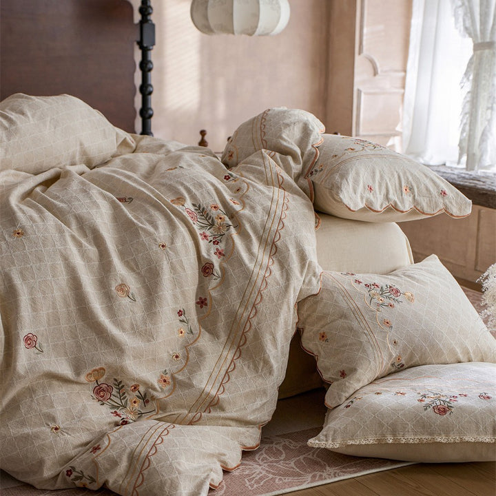 Luxurious embroidered cotton bedding set with ruffle and decorative pillow