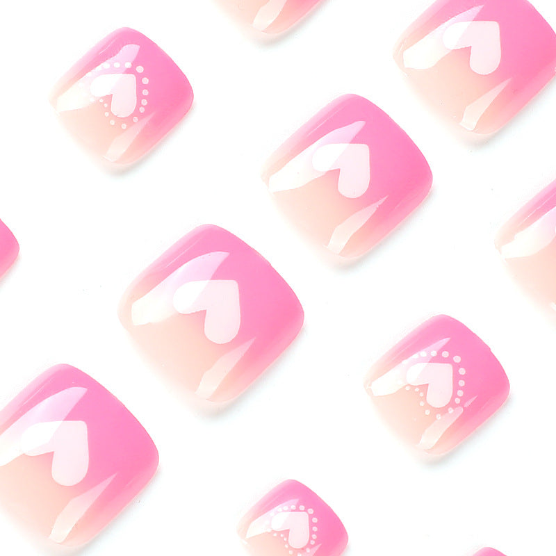 Artful toenail design with heart motifs Kalsten