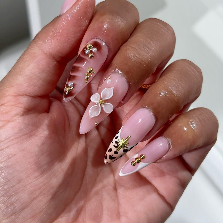 Acrylic nail set with glamorous accents and floral decorations Kalsten