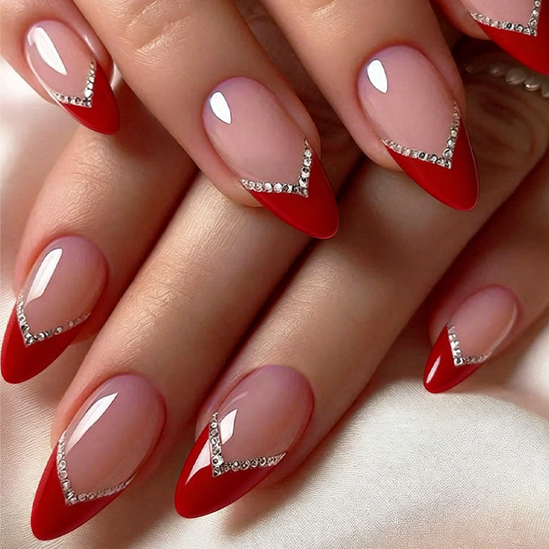 Nail art set with elegant red accents and rhinestone embellishments Kalsten