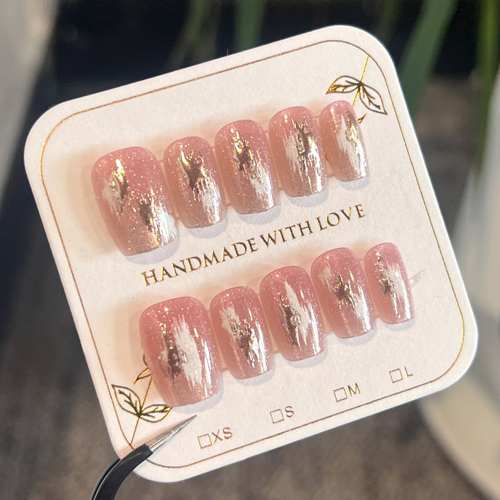 Artificial nail extensions with elegant gold design Kalsten