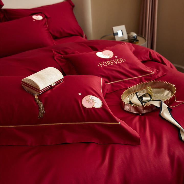 Premium cotton satin bedding set with gold piping and heart embroidery
