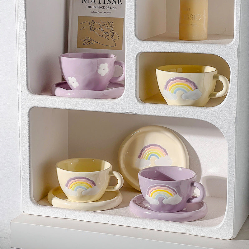 Stoneware breakfast mug with saucer and embossed rainbow design