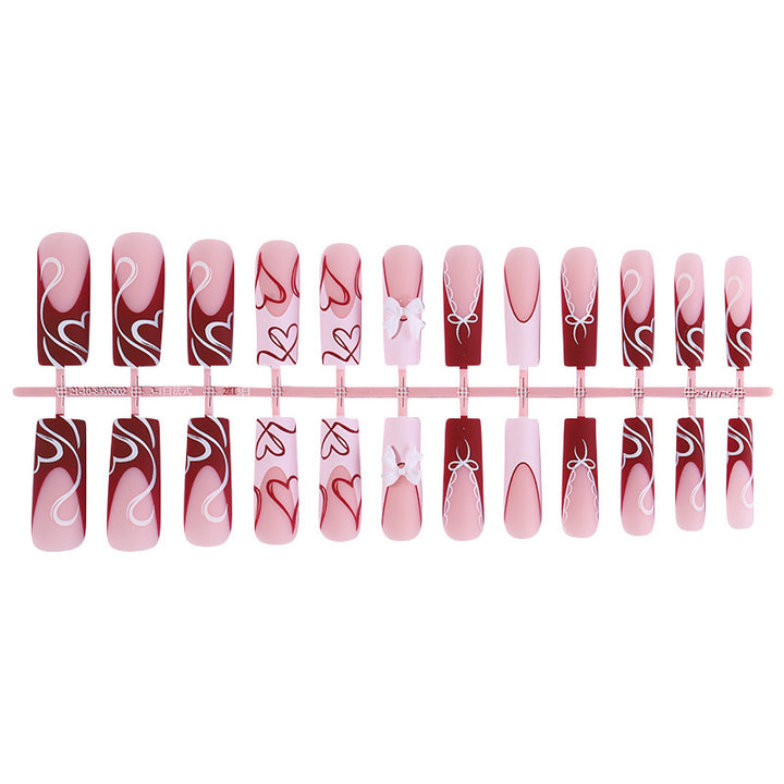 artistic nail set with heart and bow motifs Kalsten