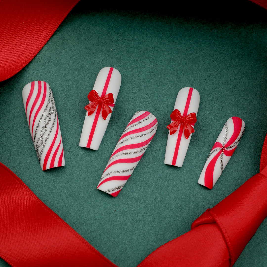 Artful Nail Art with Festive Bows and Christmas Motifs Kalsten