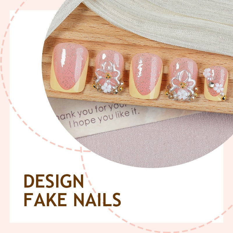 Artificial nail set with floral design and glamorous embellishments Kalsten