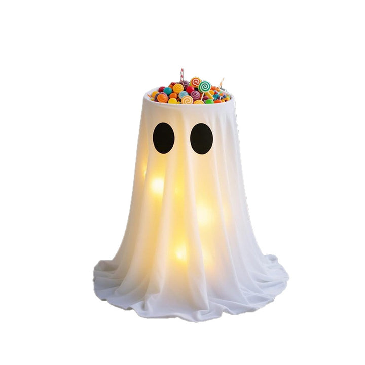 Glowing Halloween candy bowl with ghost wrap and LED interior lighting