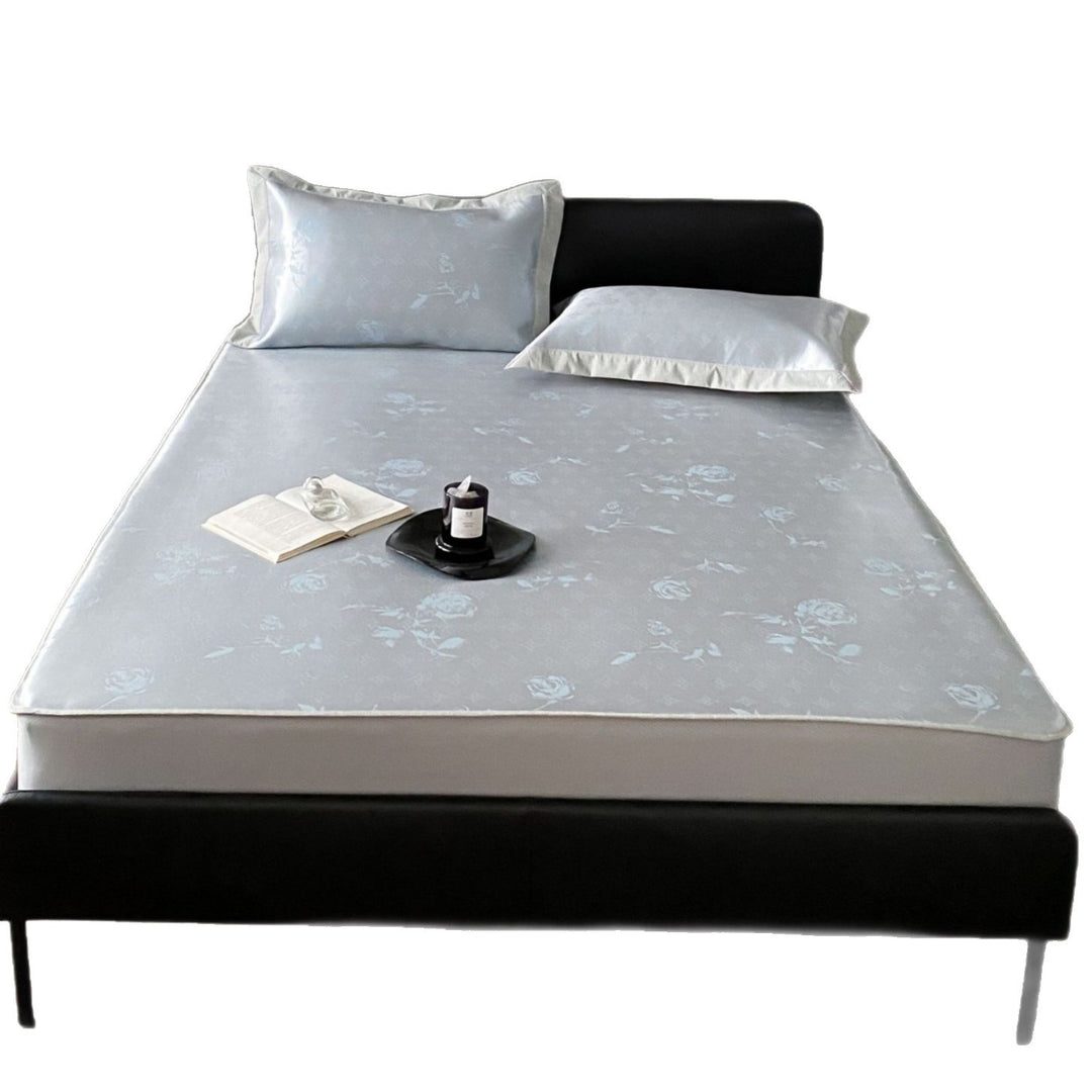Quilted mattress topper with jacquard pattern and non-slip base