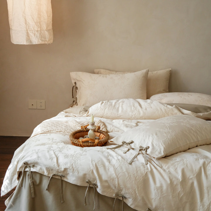 Fine cotton bedding set with jacquard floral pattern and side decorative ribbons