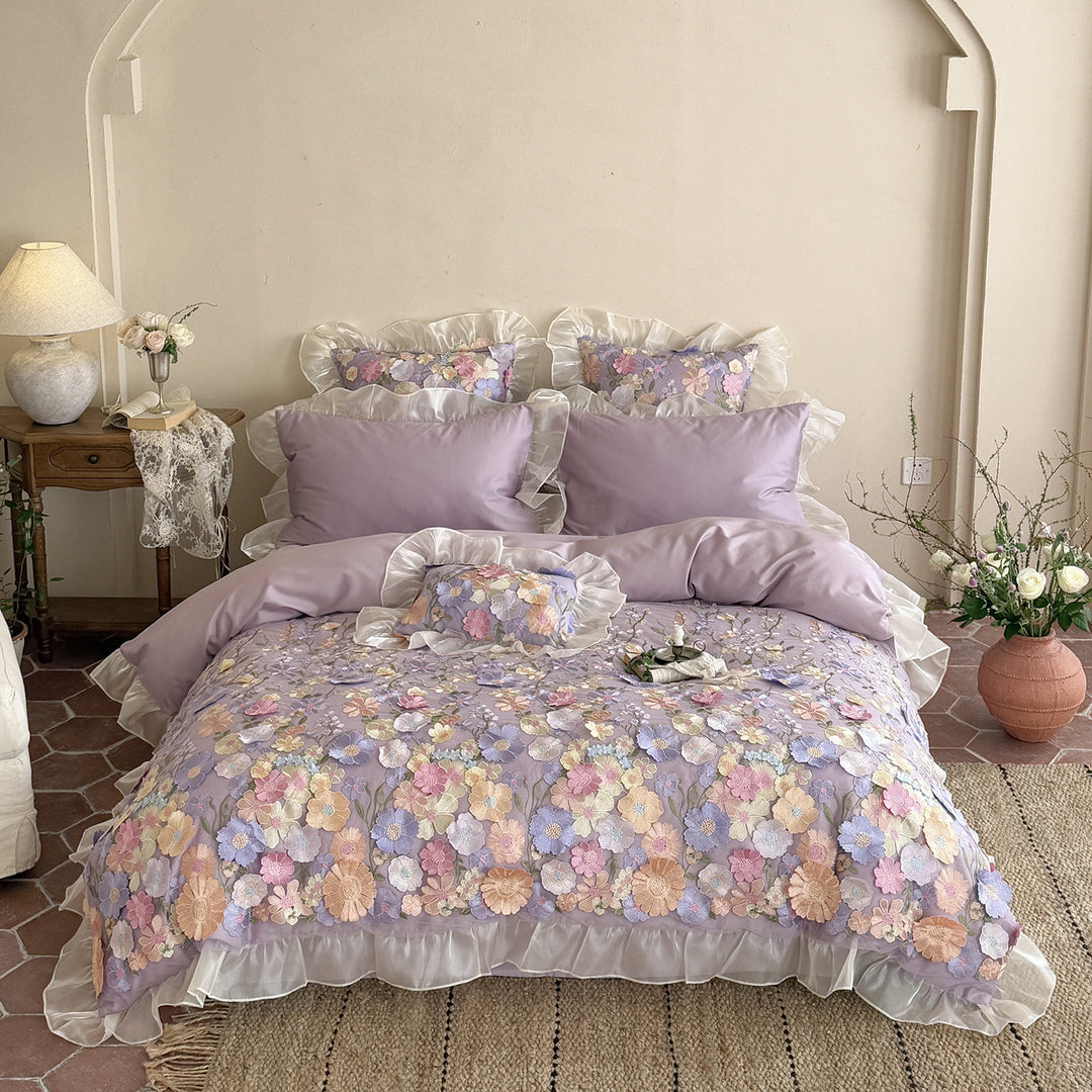 Embroidered bedding set with 3D flower application and ruffle hem