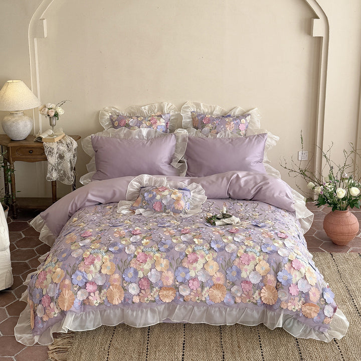 Embroidered bedding set with 3D flower application and ruffle hem