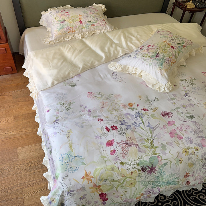 Cotton satin bed linen set with delicate watercolor botanical print and decorative ruffle