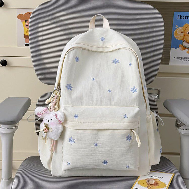 Playful backpack with fine embroidery Kalsten