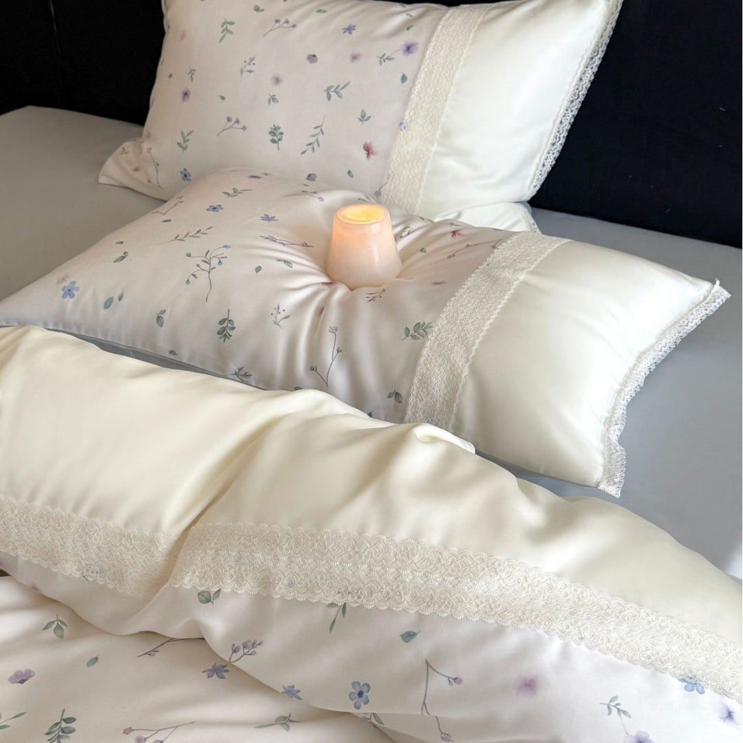 Cotton satin bedding set with delicate floral embroidery and lace trim