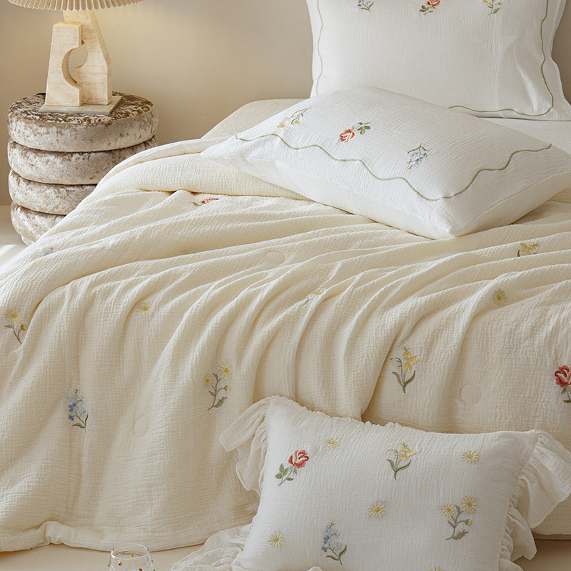 Light cotton gauze bedding set with fine floral embroidery and ruffle trim