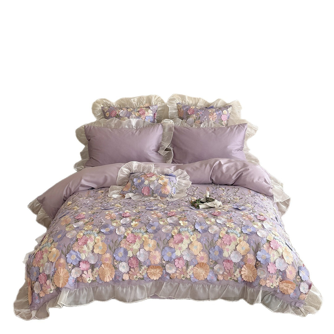 Embroidered bedding set with 3D flower application and ruffle hem
