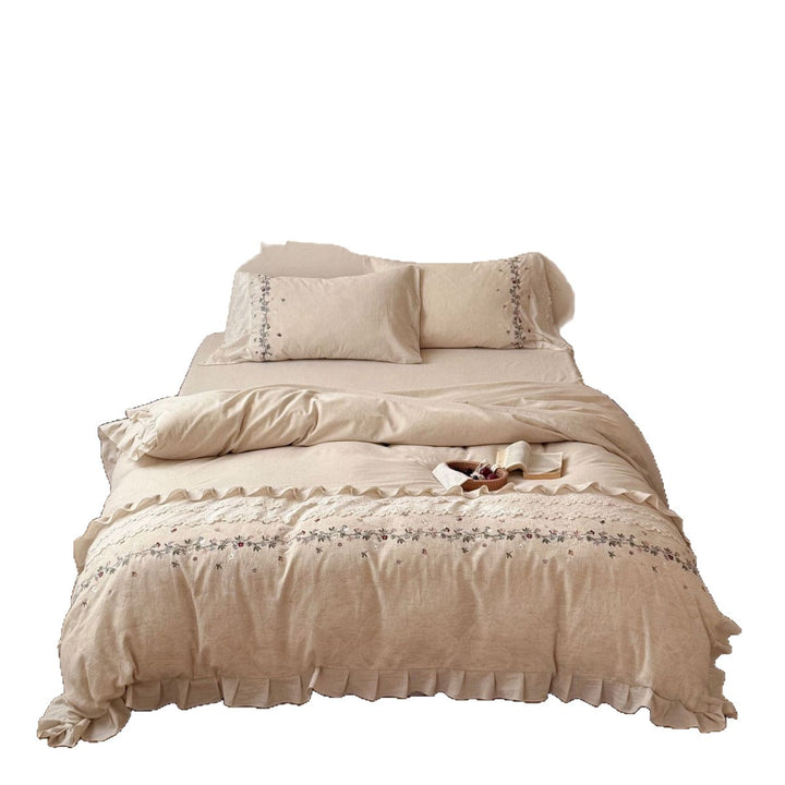 Romantic bedding set made of linen look with floral embroidery, lace trim and frill