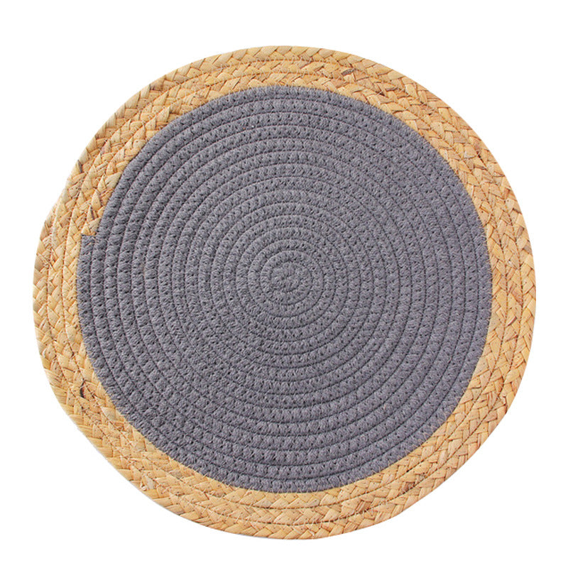 Round handwoven table placemat made of cotton yarn with structured spiral binding