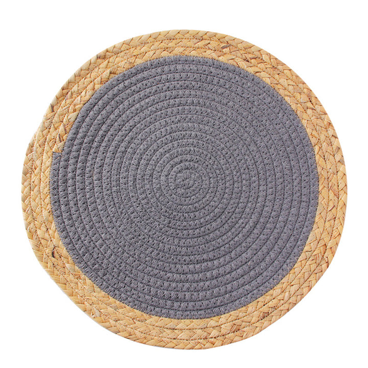 Round handwoven table placemat made of cotton yarn with structured spiral binding