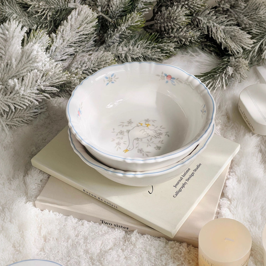 Decorative porcelain soup plate with ribbed edge and duck motif