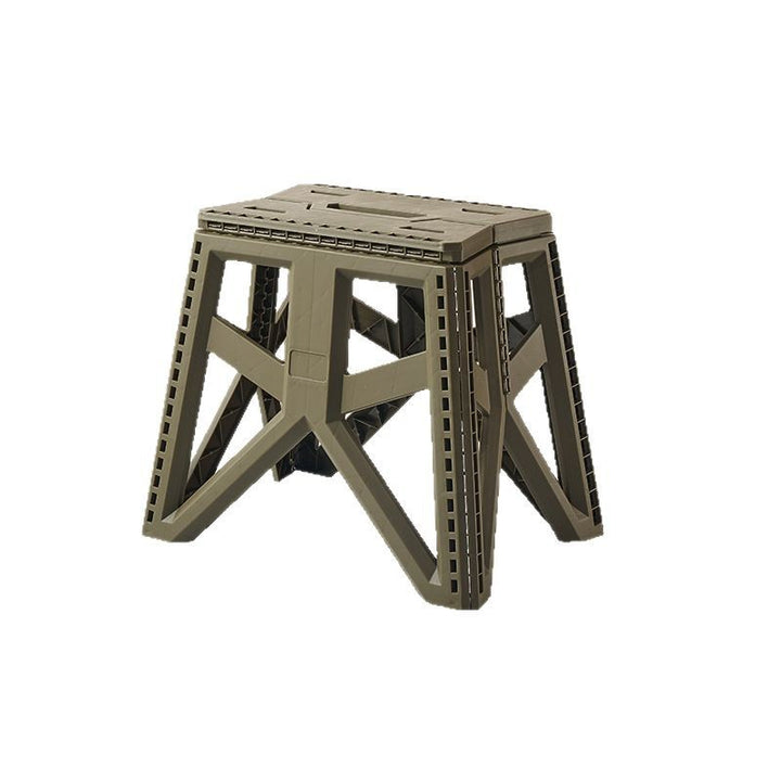 Compact foldable step stool made of shatterproof plastic with carrying handle and non-slip feet