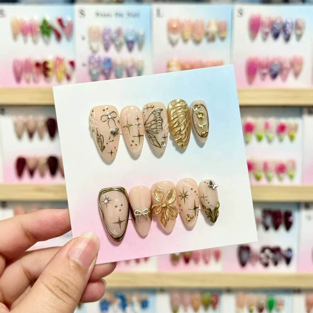 Artistic Press-On Nails Set with Gold and Floral Embellishments