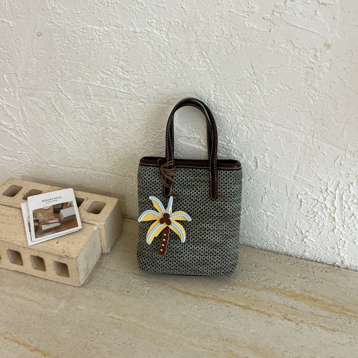 Woven Beach Handbag with Decorative Charm