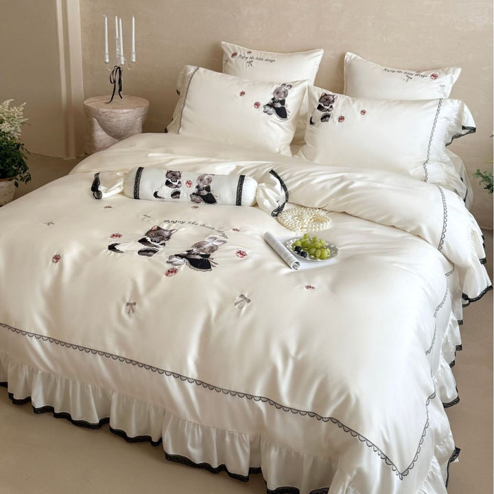 Embroidered satin bedding set with frill, ruffled hem, and animal motif