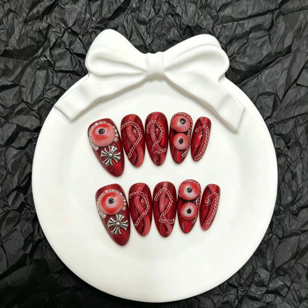 Artistic Press-On Nail Art Set with Unique Red Designs