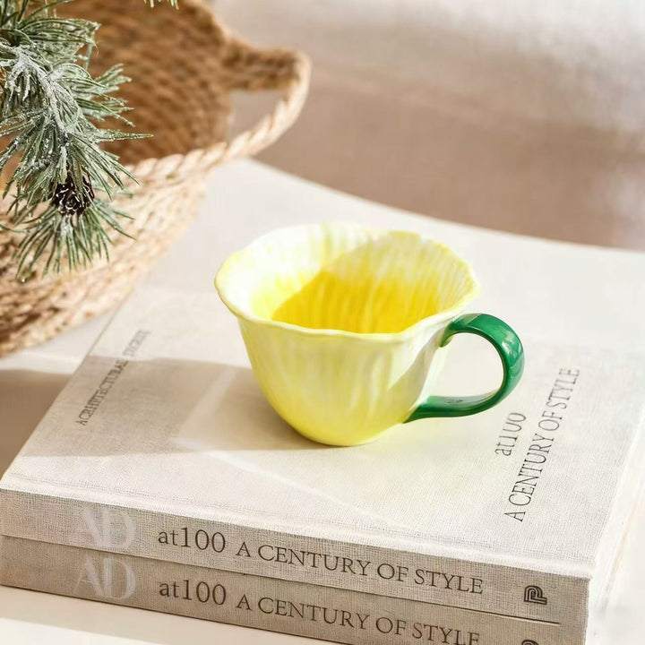Ceramic mug with saucer in flower shape