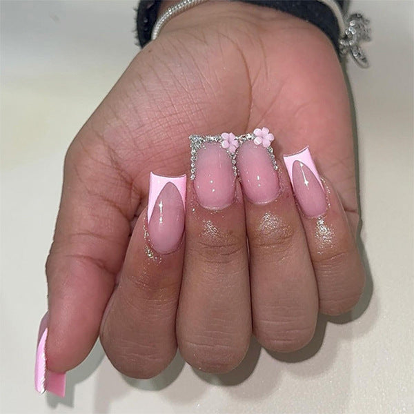 Artful gel nails with elegant floral design and glitter accents Kalsten