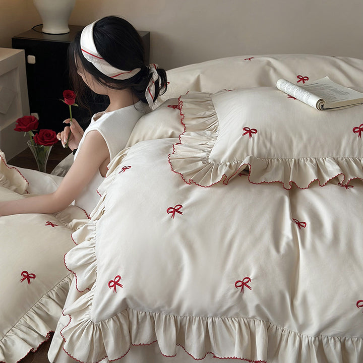 Luxurious bed linen set with ruffles and embroidered bows